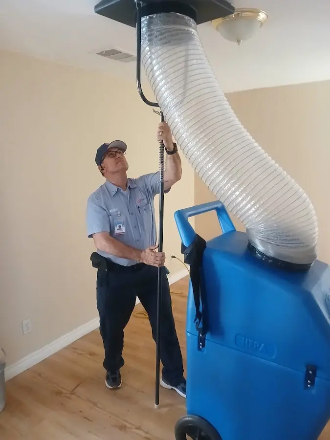 Furnace Tune-Up technician using HEPA equipment in Fish Hawk